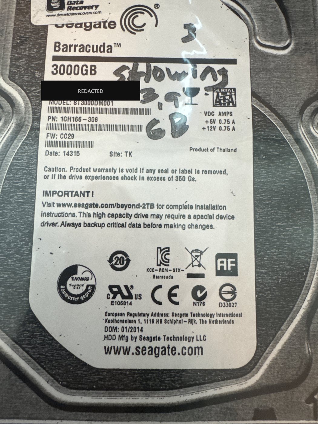 Seagate Barracuda ST3000DM001 3 TB drive marked by hand as drive 3, noted as showing only a few GB, serial number redacted